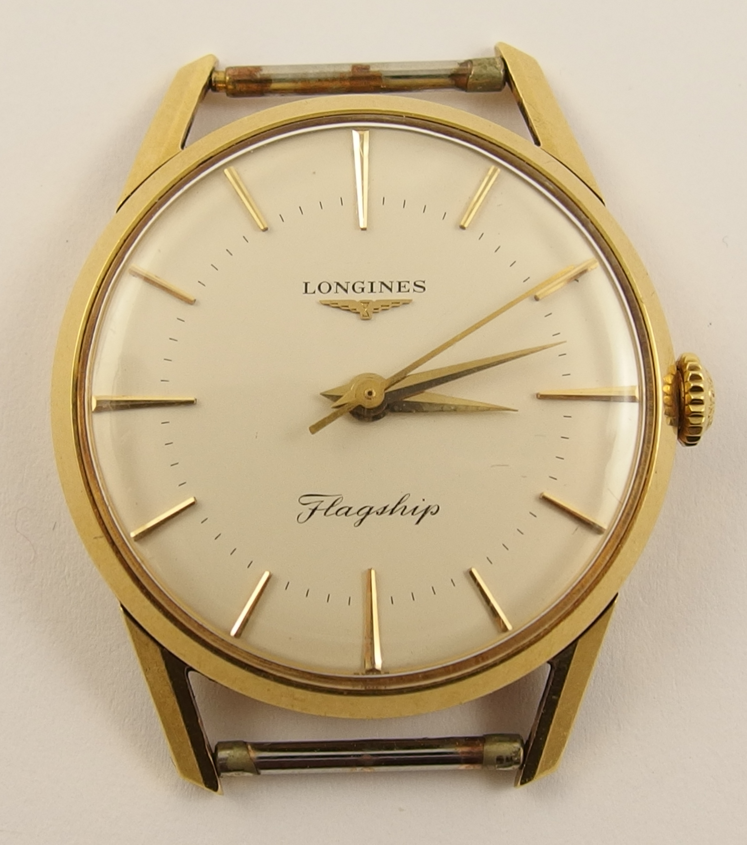 A gents 18ct gold Longines Flagship watch head the champagne dial has gold coloured baton