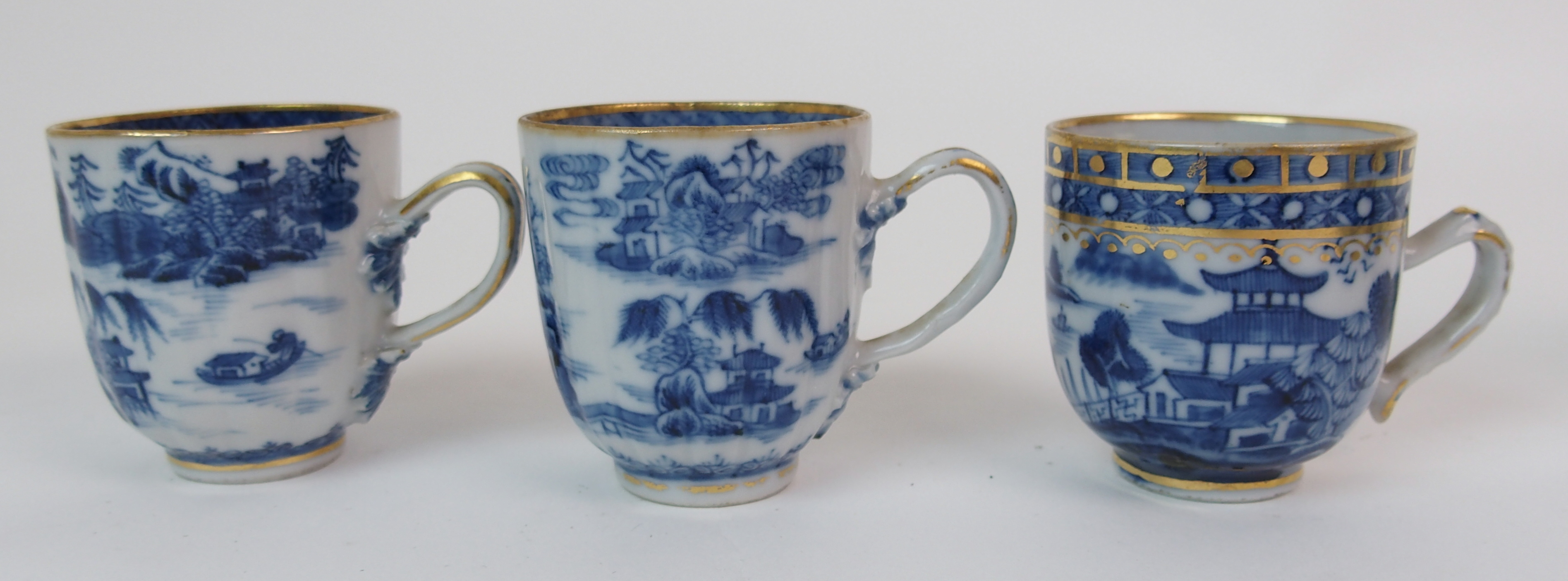 A group of twenty-three Chinese export teacups painted with typical landscapes and gilt rims, - Image 9 of 10