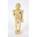 A Napoleonic Prisoner of War marine ivory carving of a male figure in uniform, possibly Napoleon,
