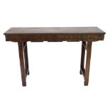 A Chinese hardwood alter table carved with a geometric pattern frieze on square legs, 138cm wide x