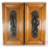 A pair of bronze wall plaques each cast with ribbon tied game and fish mounted on oak moulded