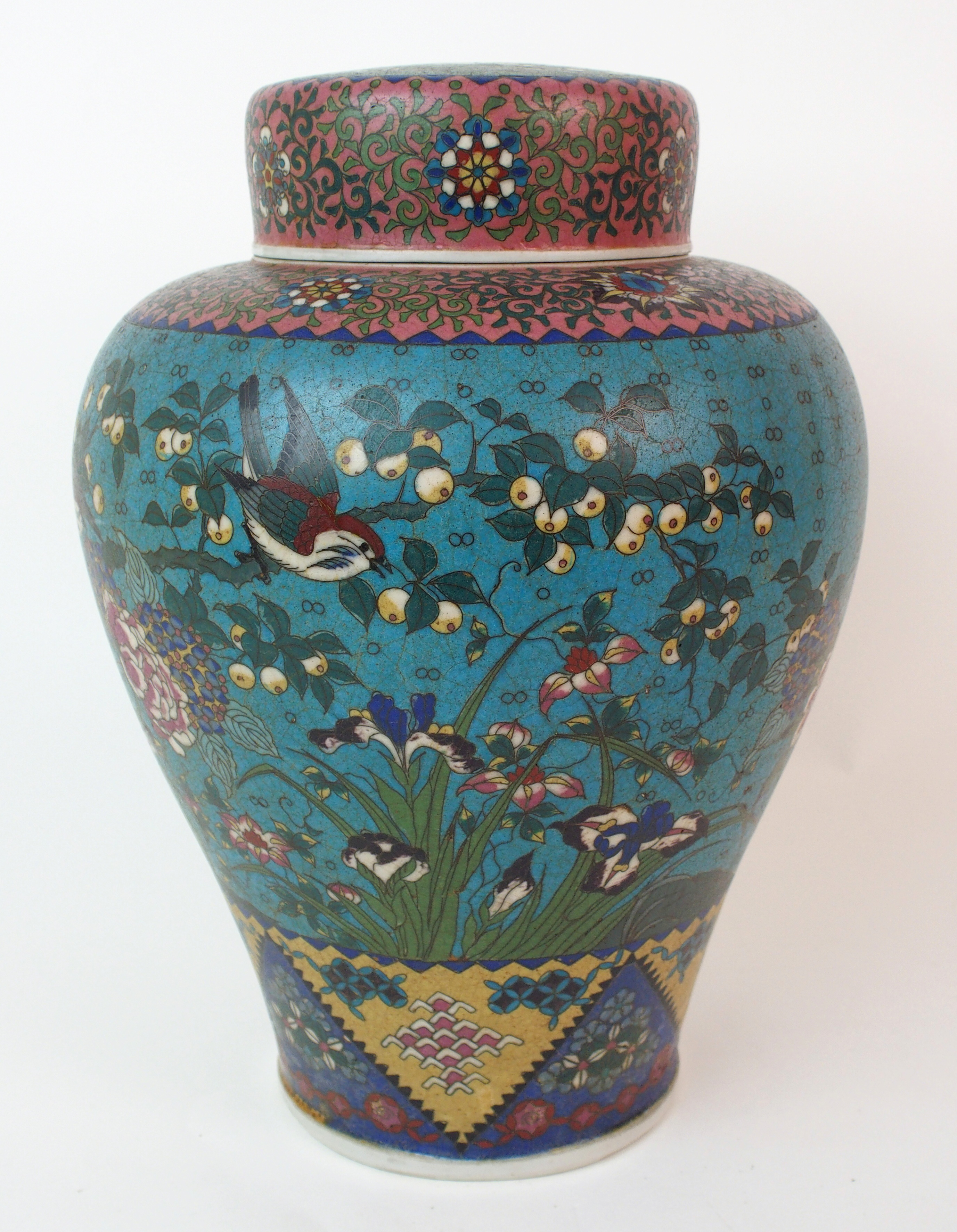 A Chinese cloisonne porcelain baluster jar and cover decorated with birds amongst flowers within