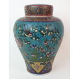 A Chinese cloisonne porcelain baluster jar and cover decorated with birds amongst flowers within