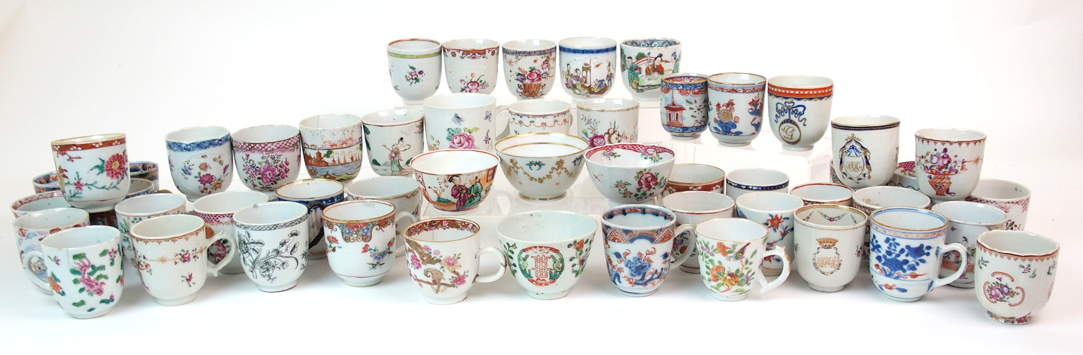 Forty Seven various Chinese export tea-cups painted with flowers, figures, birds and monograms and