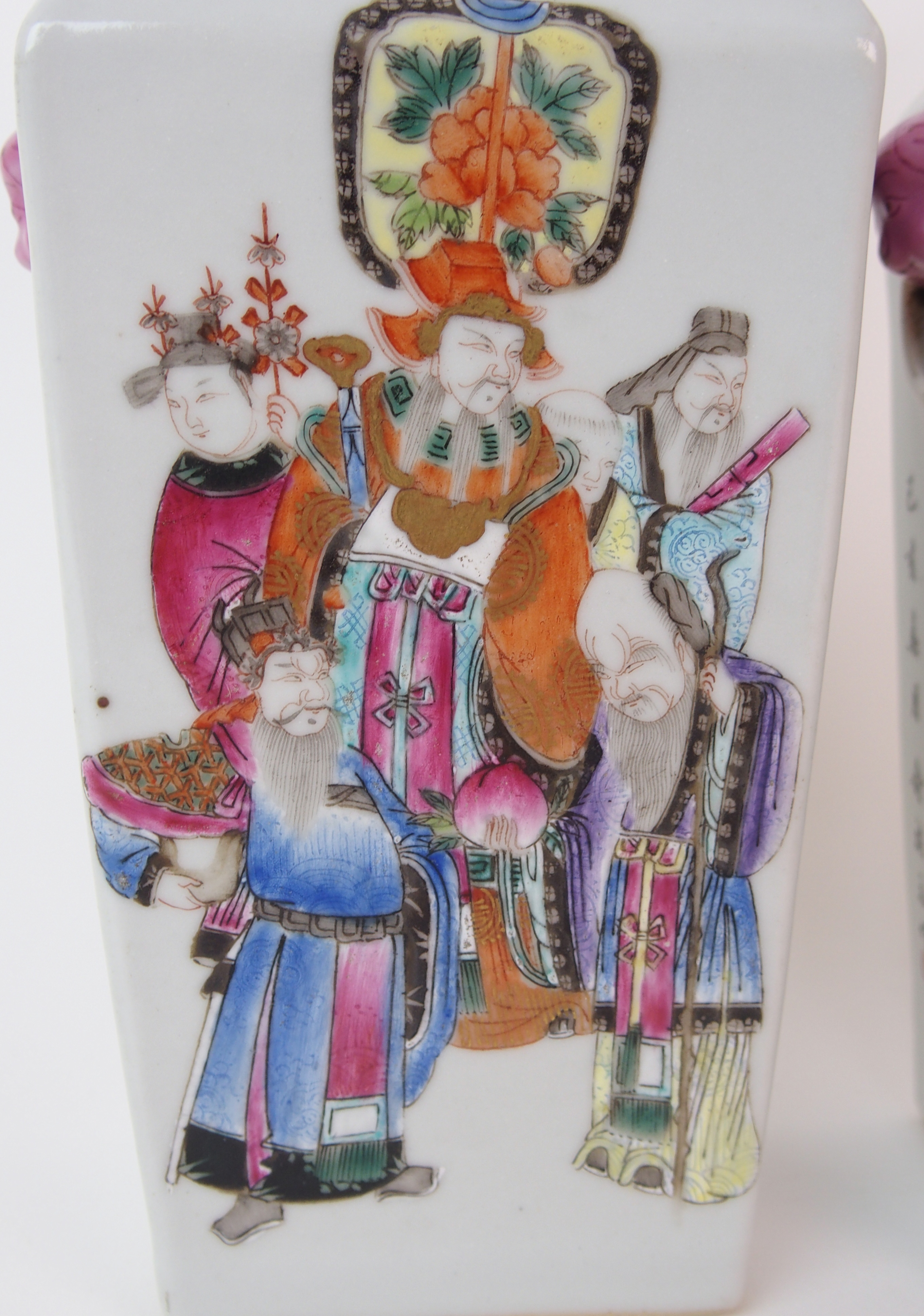 A pair of Canton famille rose square baluster vases painted with mandarins and courtesans divided by - Image 2 of 10