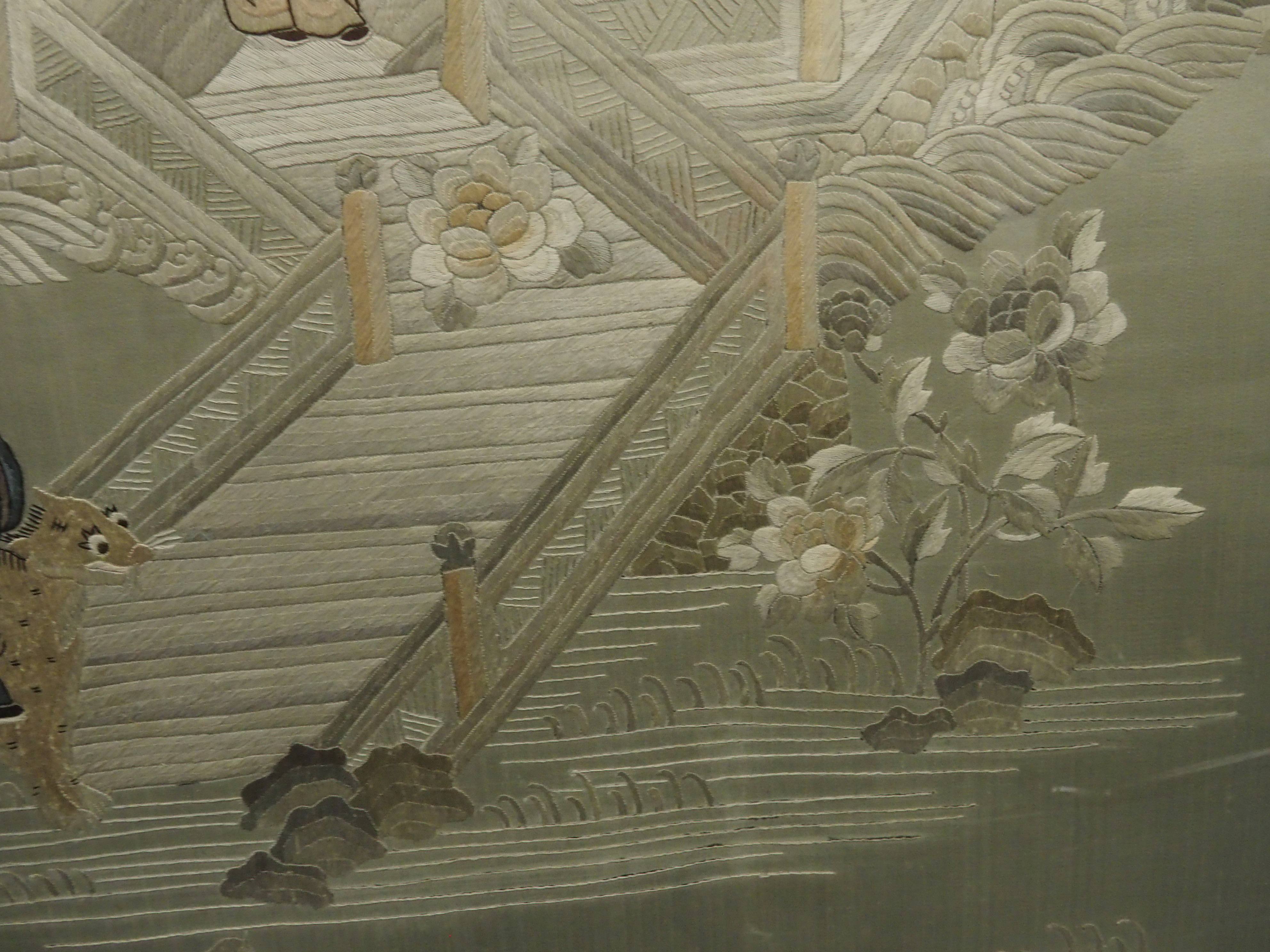 A Chinese silk embroidered picture of figures in a walled garden on an island amongst foliage, 156 x - Image 8 of 8