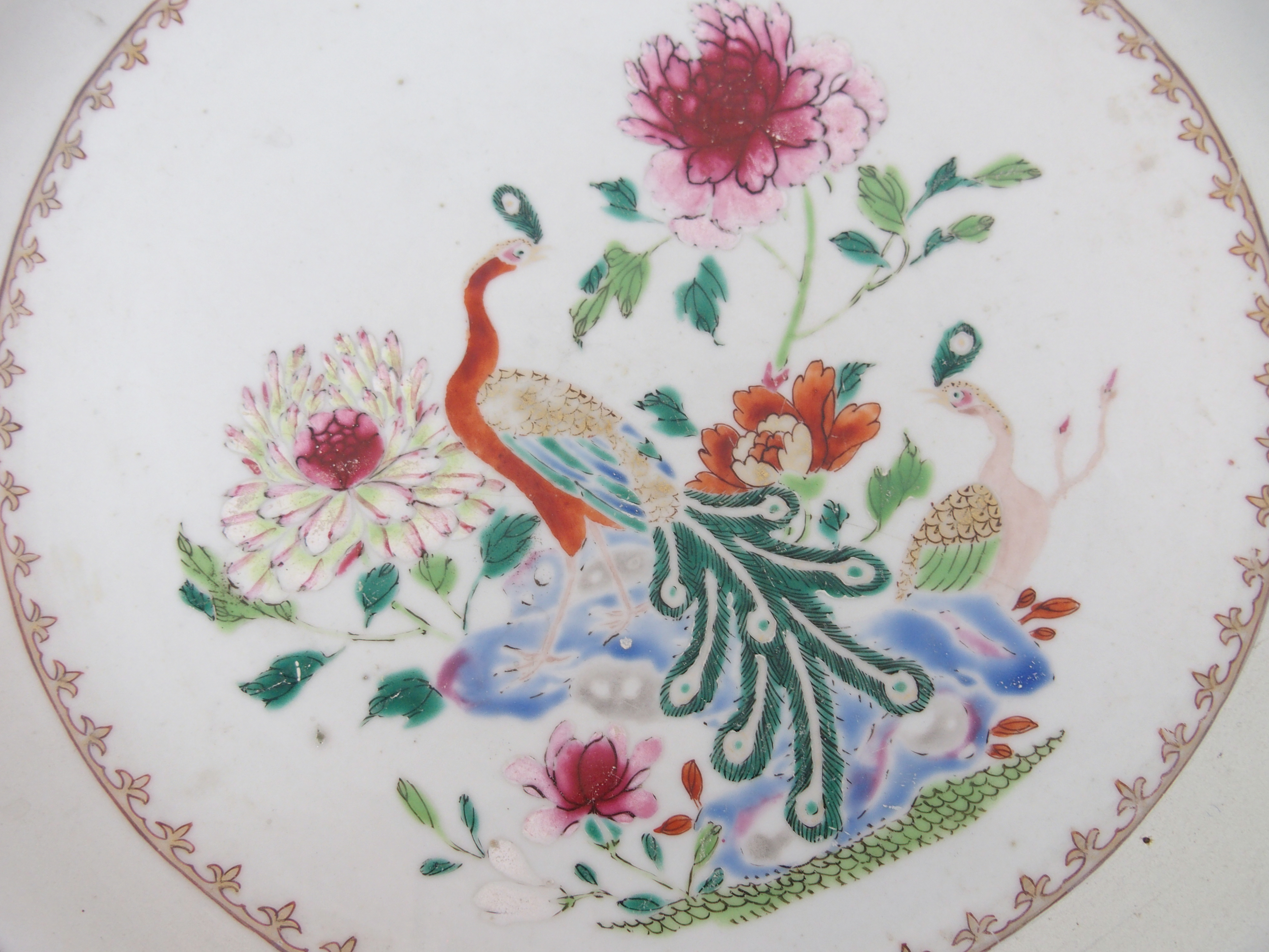 A Chinese famille rose export charger painted with a peacock and hen within a border of birds and - Image 3 of 10