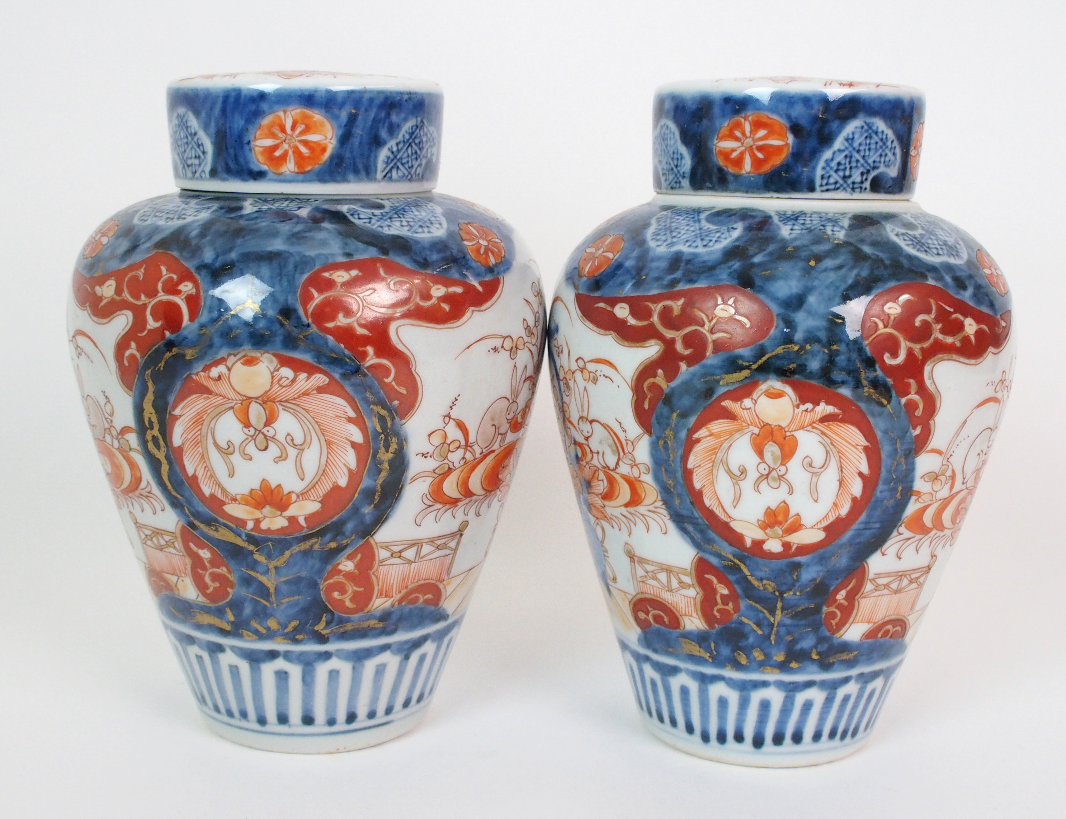 A pair of Imari baluster vases, covers and liners  painted with jardinieres of flowers and rabbits - Image 4 of 10