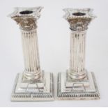 *WITHDRAWN* A pair of silver candlesticks by Richard Martin and Ebenezer Hall, Sheffield 1909, the