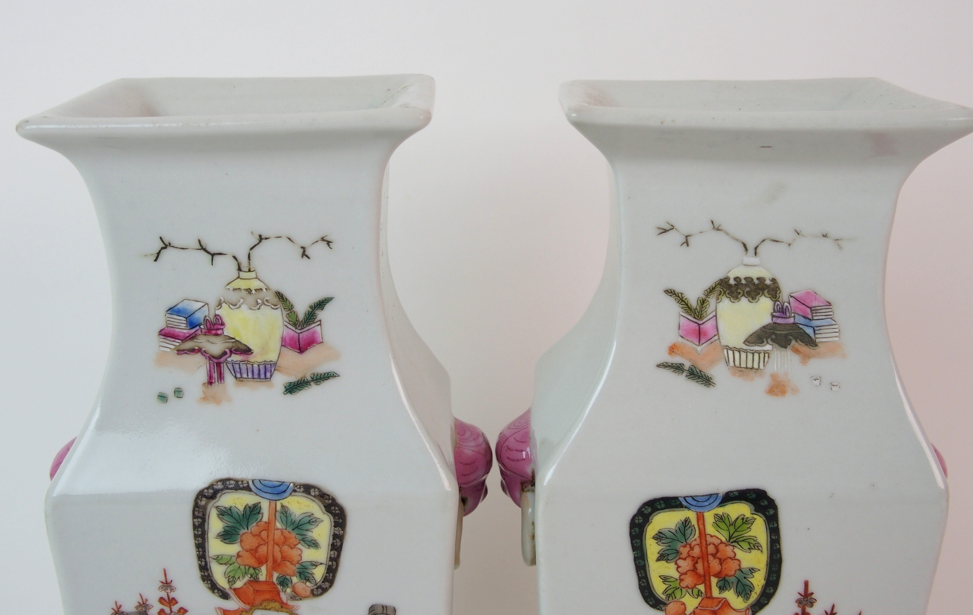 A pair of Canton famille rose square baluster vases painted with mandarins and courtesans divided by - Image 4 of 10