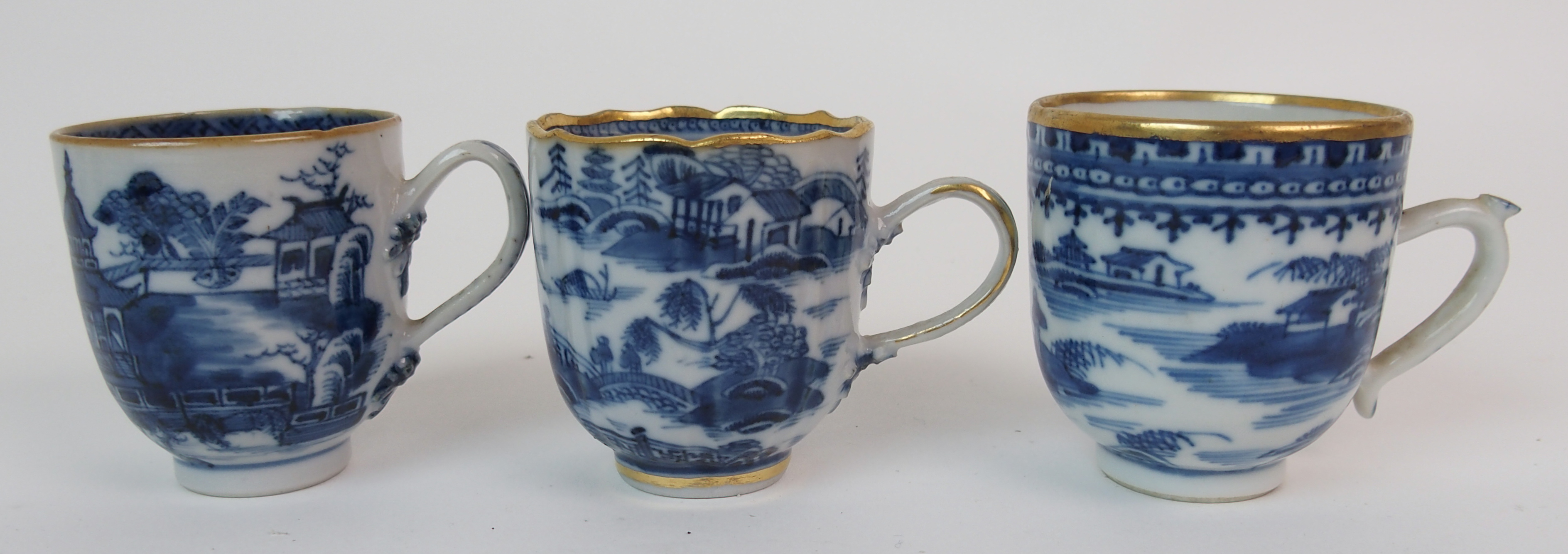 A group of twenty-three Chinese export teacups painted with typical landscapes and gilt rims, - Image 7 of 10