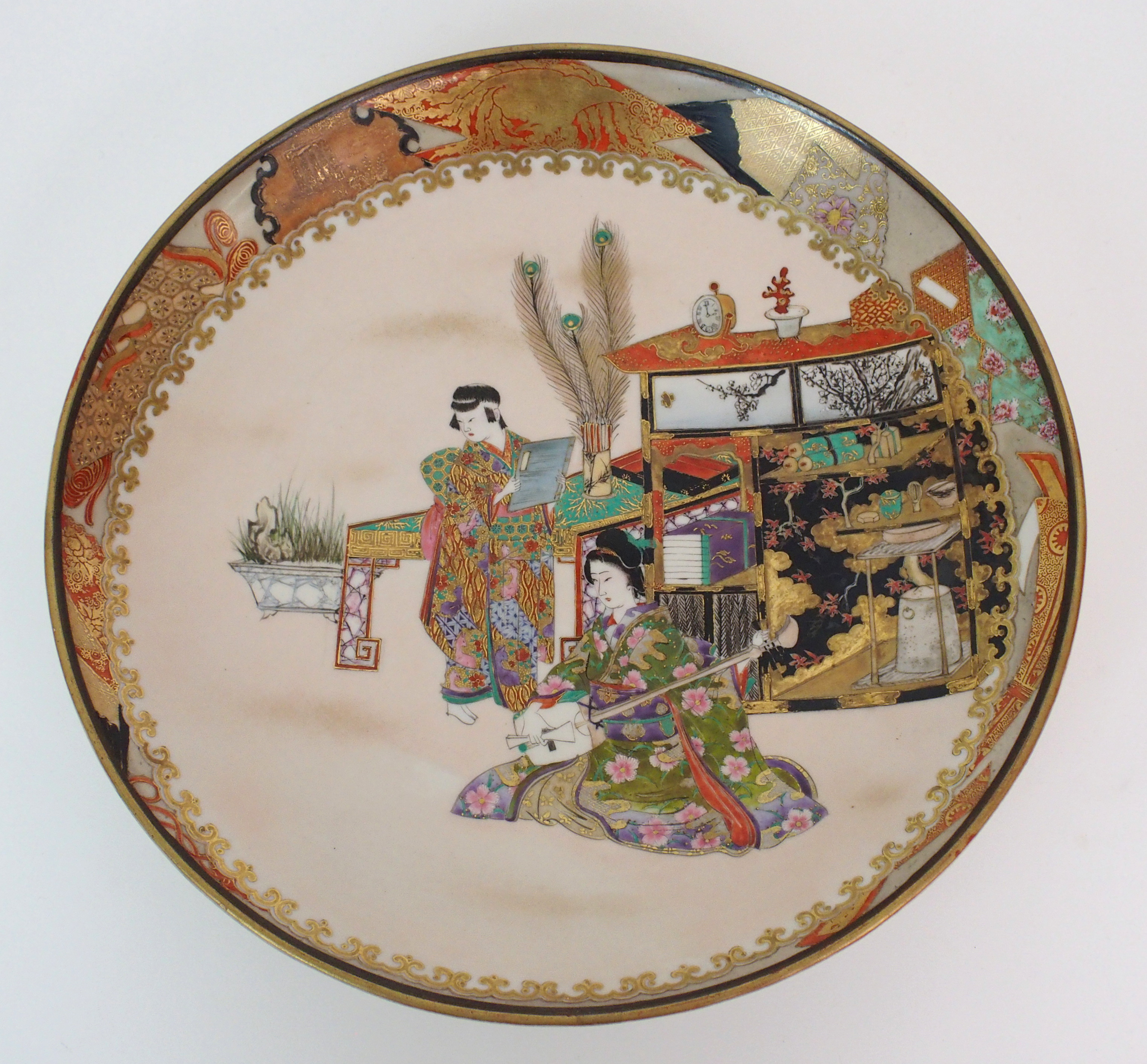 A pair of Japanese dishes painted with ladies playing musical instruments amongst precious objects - Image 9 of 10