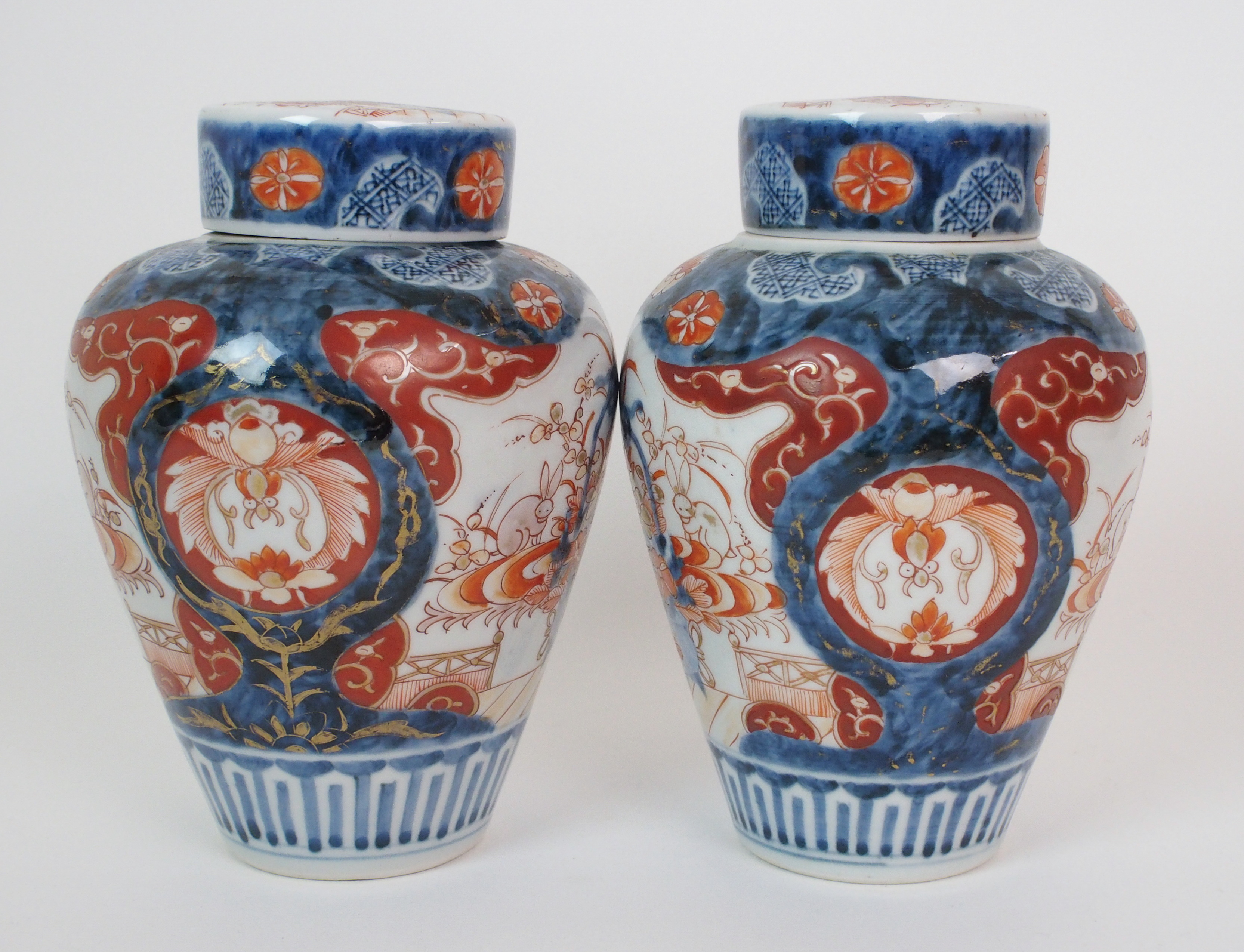 A pair of Imari baluster vases, covers and liners  painted with jardinieres of flowers and rabbits - Image 2 of 10