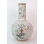 A Chinese baluster vase painted with a peach tree issuing from rockwork and a bird amongst flowering