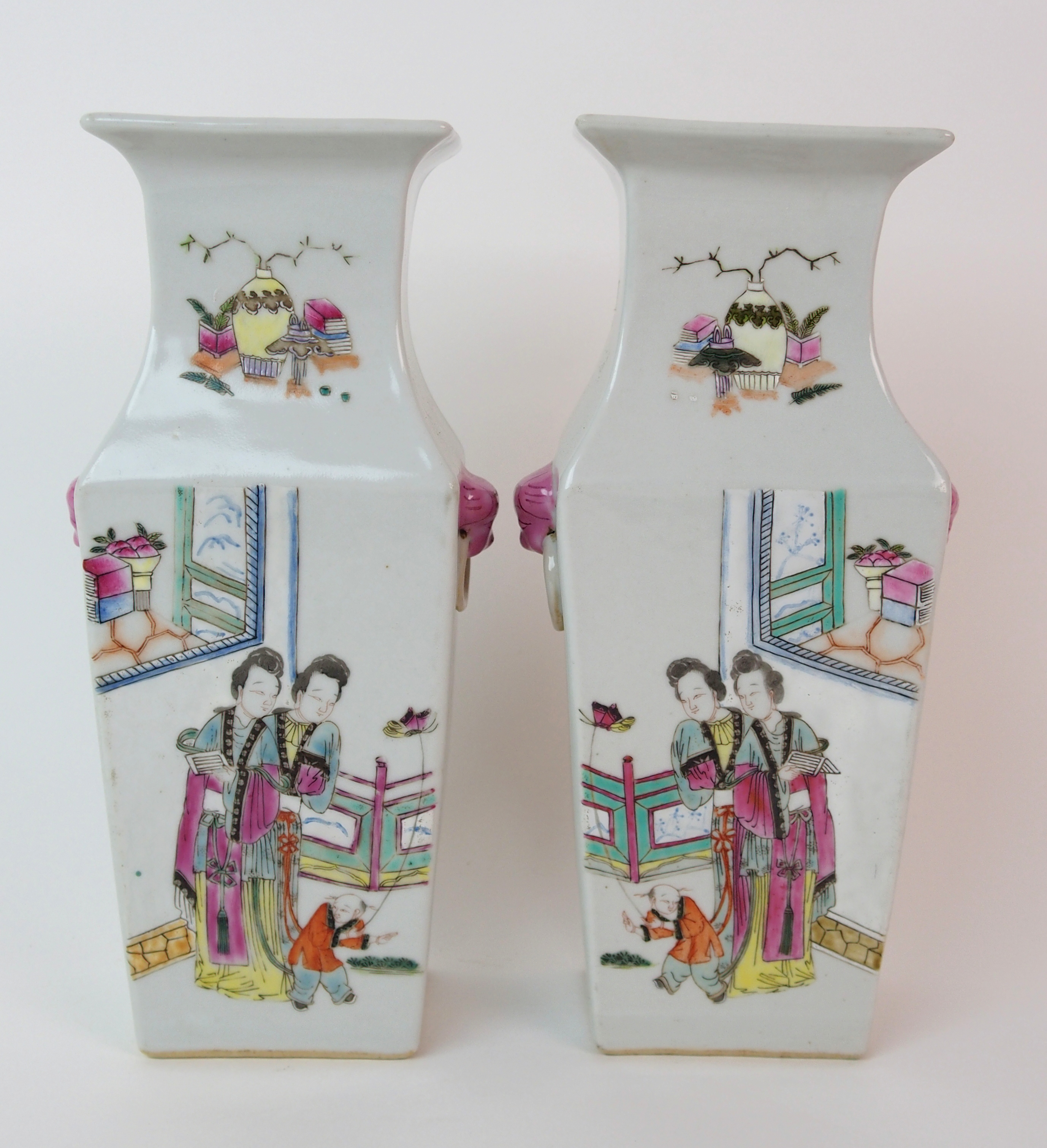 A pair of Canton famille rose square baluster vases painted with mandarins and courtesans divided by - Image 6 of 10