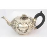 A late 18th Century silver teapot by Charles Hougham, London 1789, of squat globular form, the