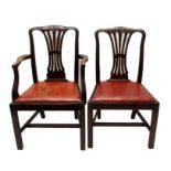 A set of eight mahogany dining chairs including two carvers the pierced backs carved with Prince