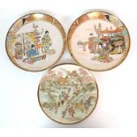 A pair of Japanese dishes painted with ladies playing musical instruments amongst precious objects