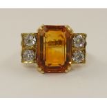 An 18ct Art Deco cocktail ring set with a bicolour citrine and four old cut diamonds to a combined