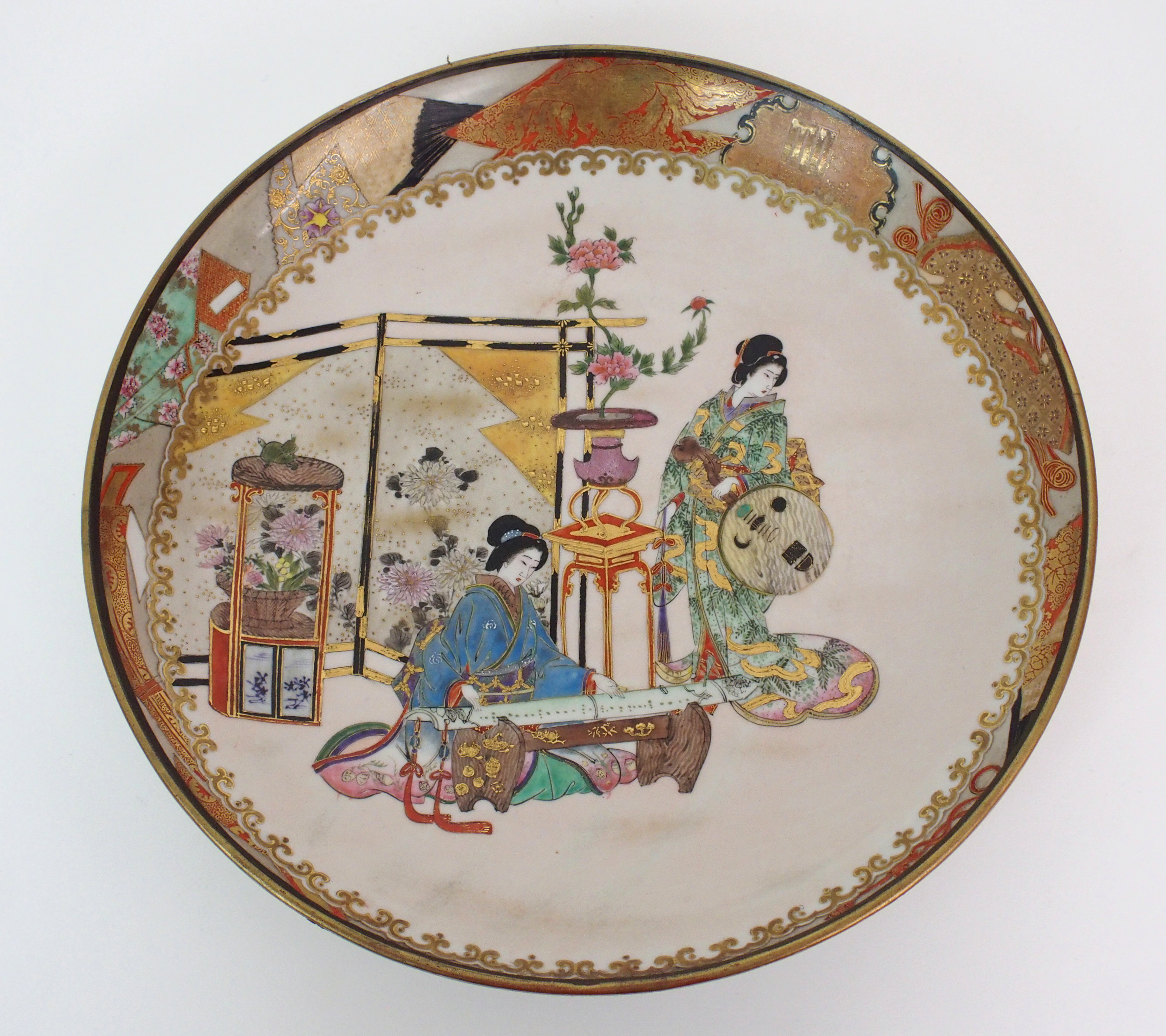 A pair of Japanese dishes painted with ladies playing musical instruments amongst precious objects - Image 6 of 10