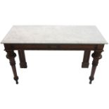 A Victorian oak console table with carved shield medallions above fluted baluster legs with white