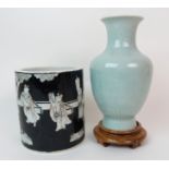 A Chinese celadon moulded baluster vase incised with key pattern, 20cm high and a modern black