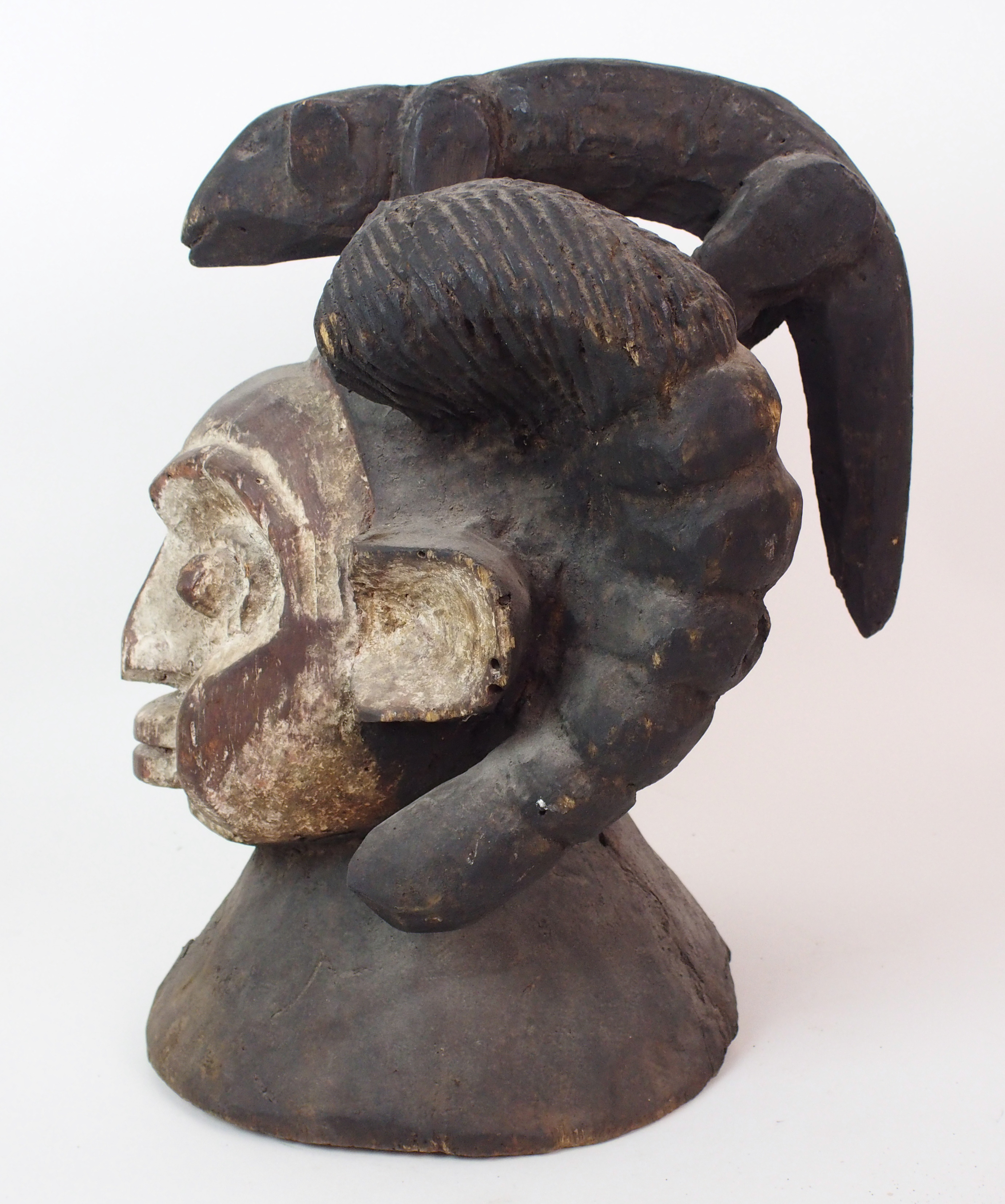 An African carved and painted wood mask with animal finial and scroll shaped ears, 38cm high - Image 5 of 10