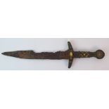 An antique dagger the hilt with gilt decoration, the pommel set with white metal roundels showing