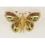 A superb example of a plique a jour enamel and gem stone brooch the wings are enamelled in