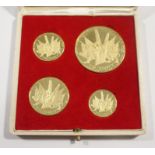 Four Winston Churchill 18ct gold commemorative medallions Metal Import Limited in original case,