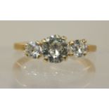 A three stone diamond ring  of approximately 1.25cts combined, in classic open galleried mount