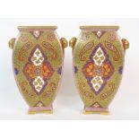 A pair of Coalport porcelain enamelled vases of Persian design and decoration, four-sided ovoid-