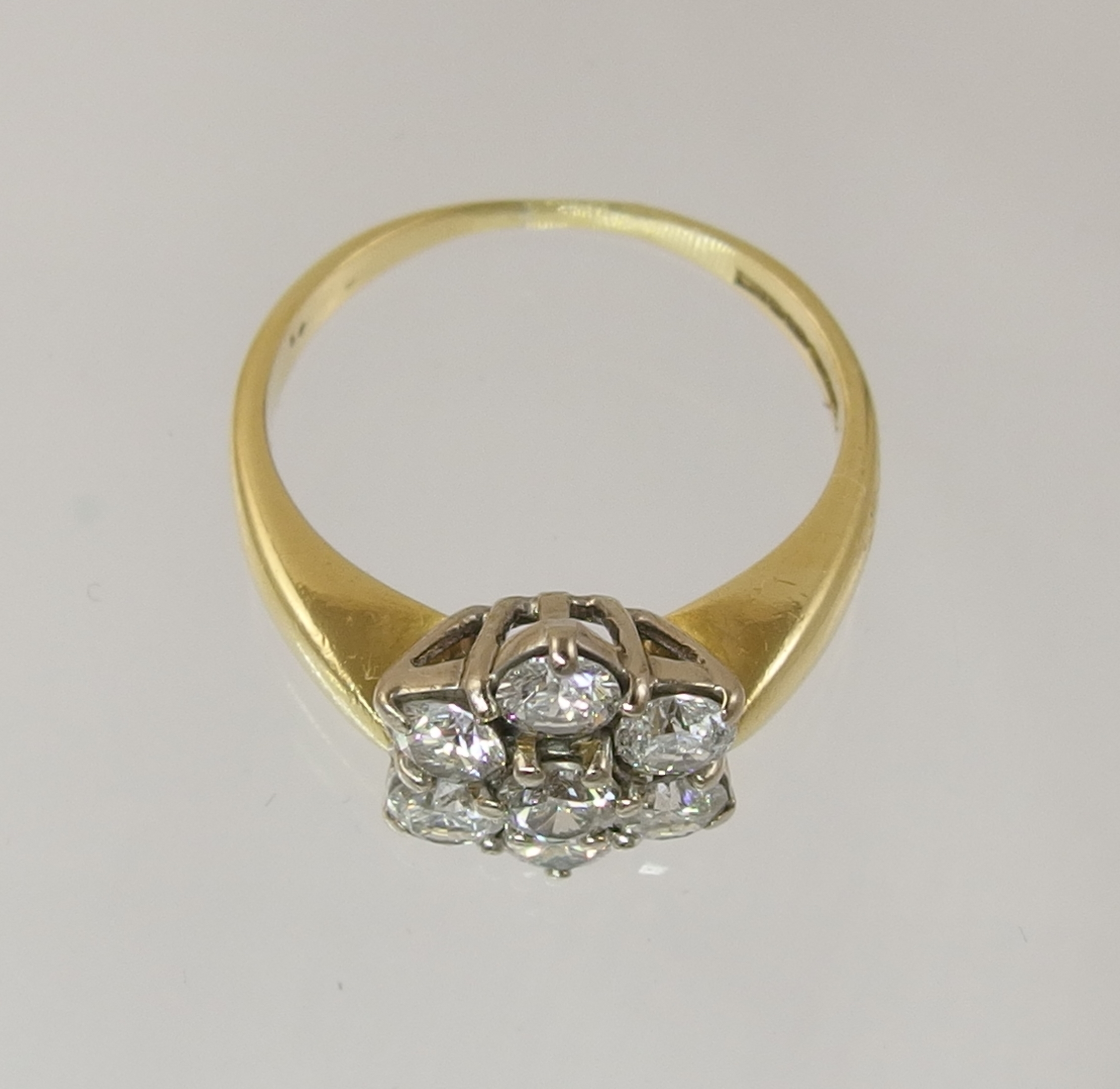 An 18ct diamond daisy cluster ring with an approximate diamond total of 0.80cts, finger size M. - Image 6 of 7