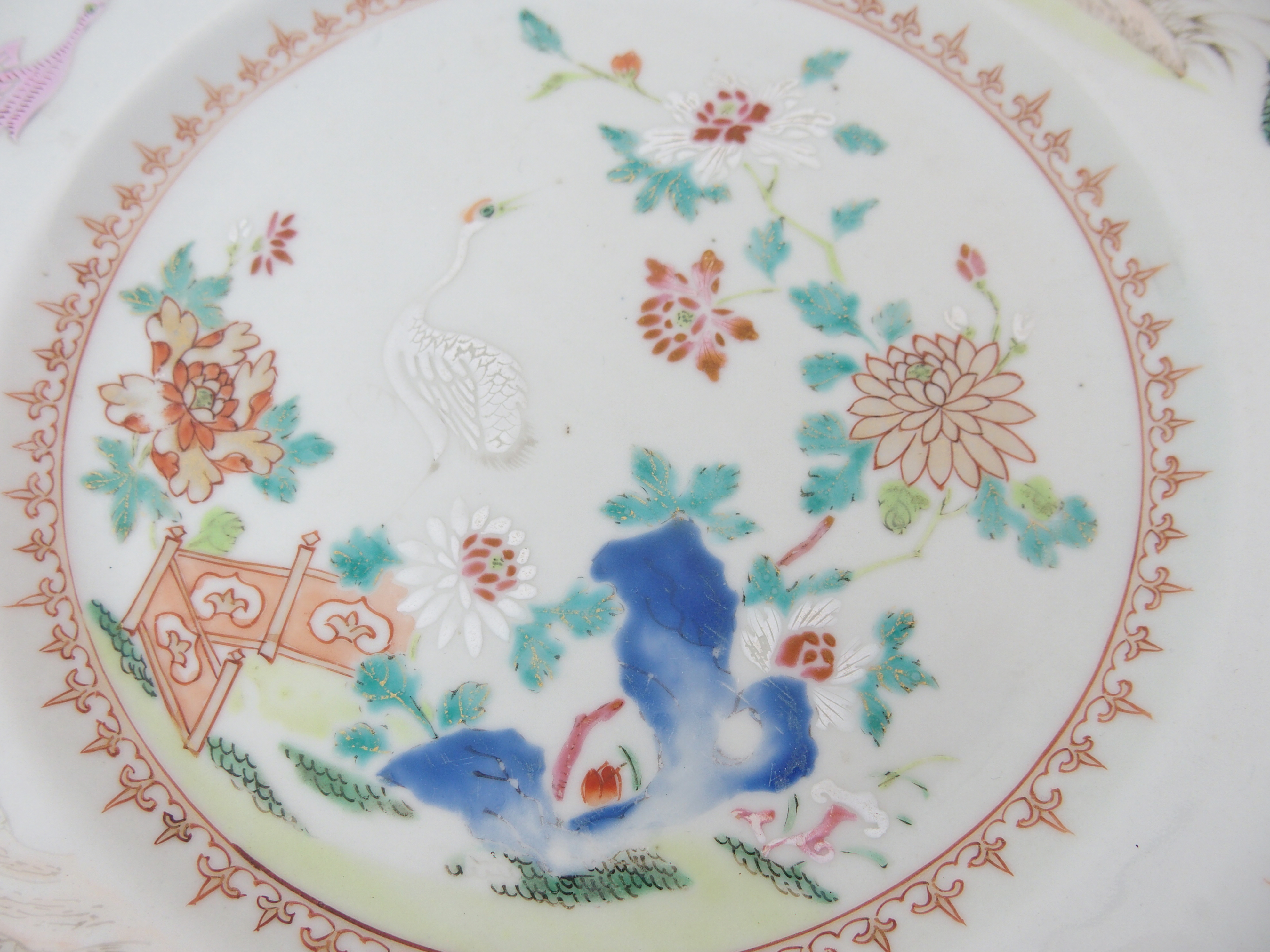 A Chinese famille rose export charger painted with a peacock and hen within a border of birds and - Image 7 of 10