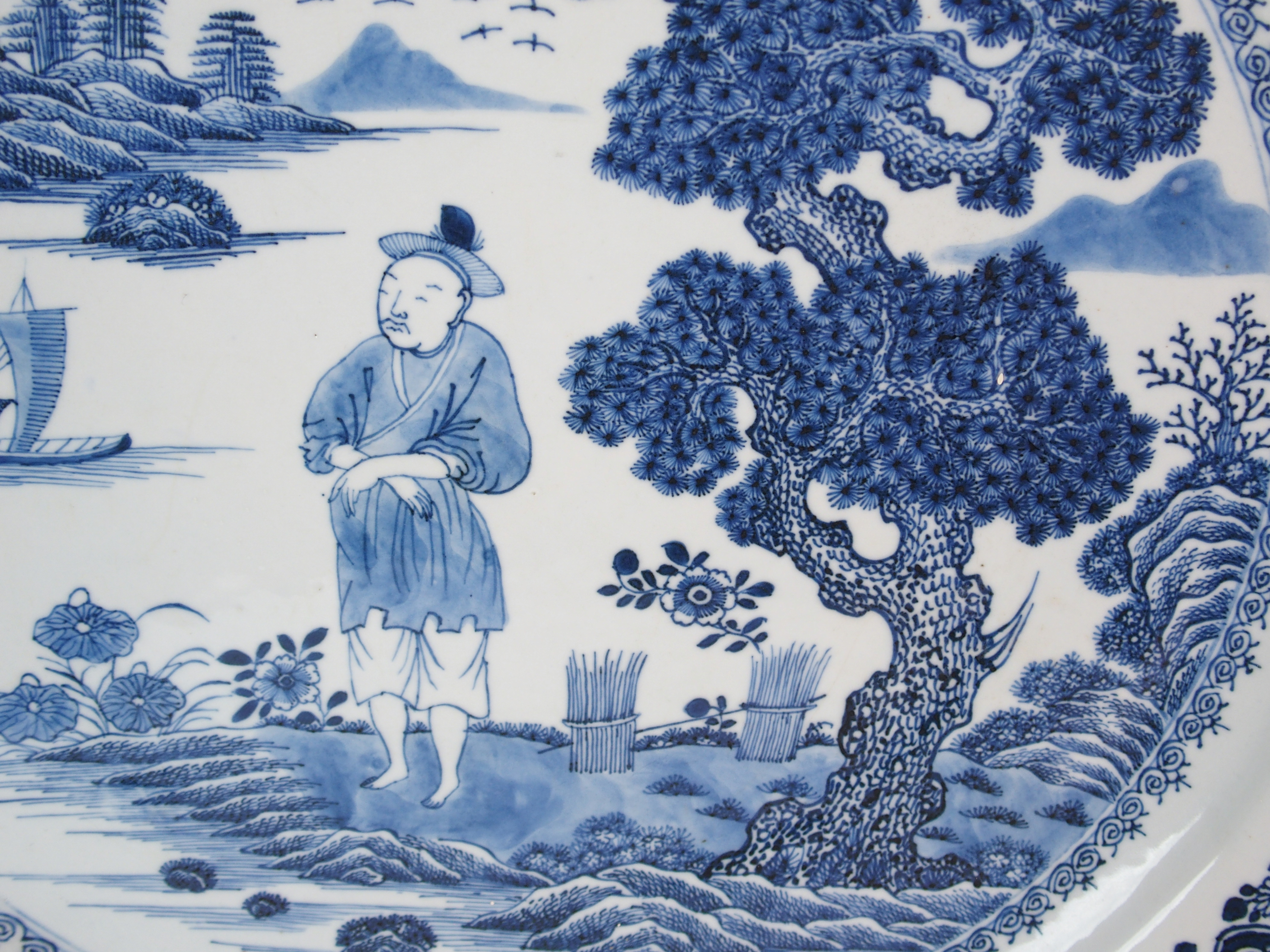A Chinese blue and white charger painted with a man standing on an island beneath a pine tree - Image 4 of 10