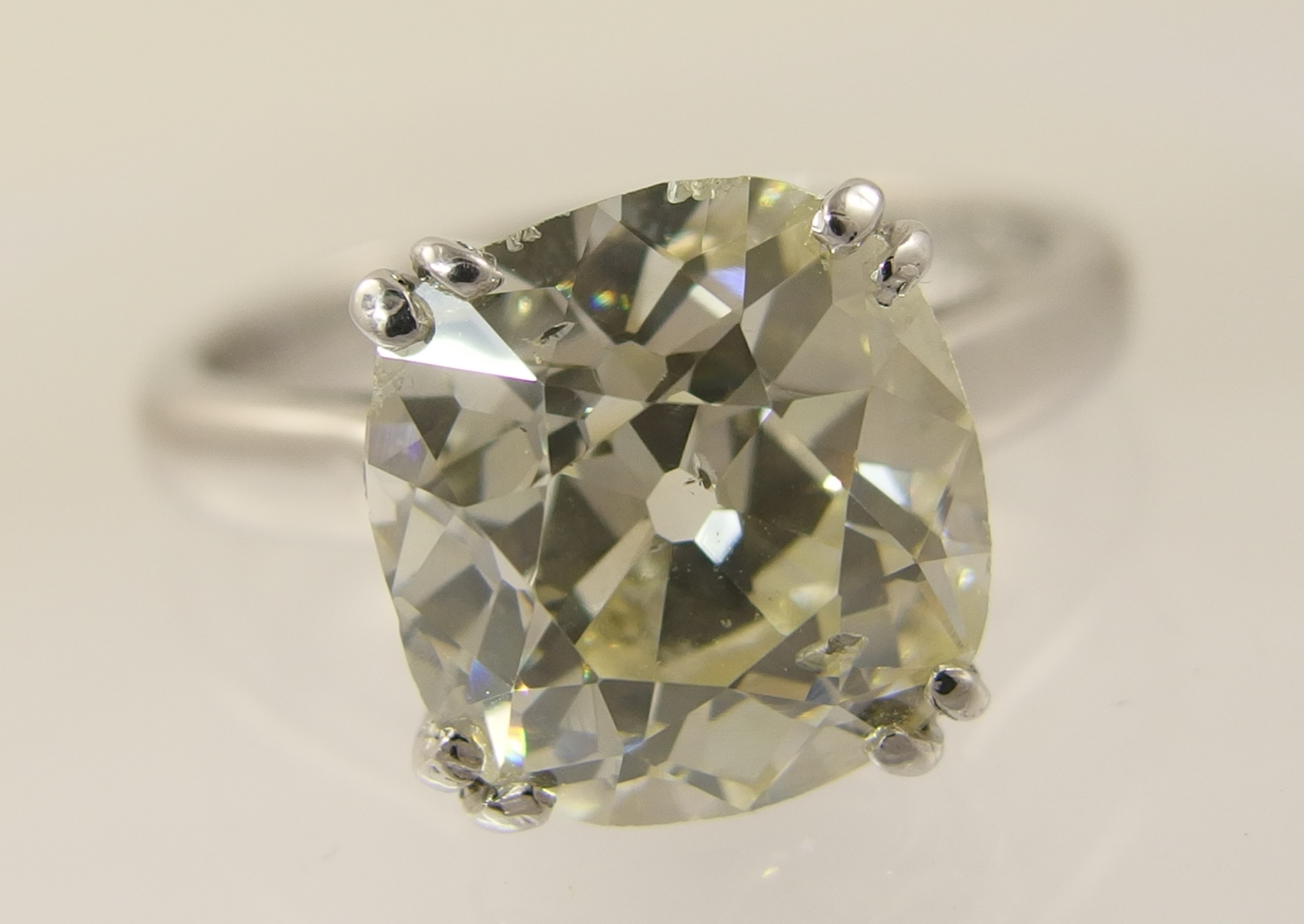A 5ct cushion cut diamond ring simply split four claw set in 18ct white gold the substantial diamond - Image 7 of 10