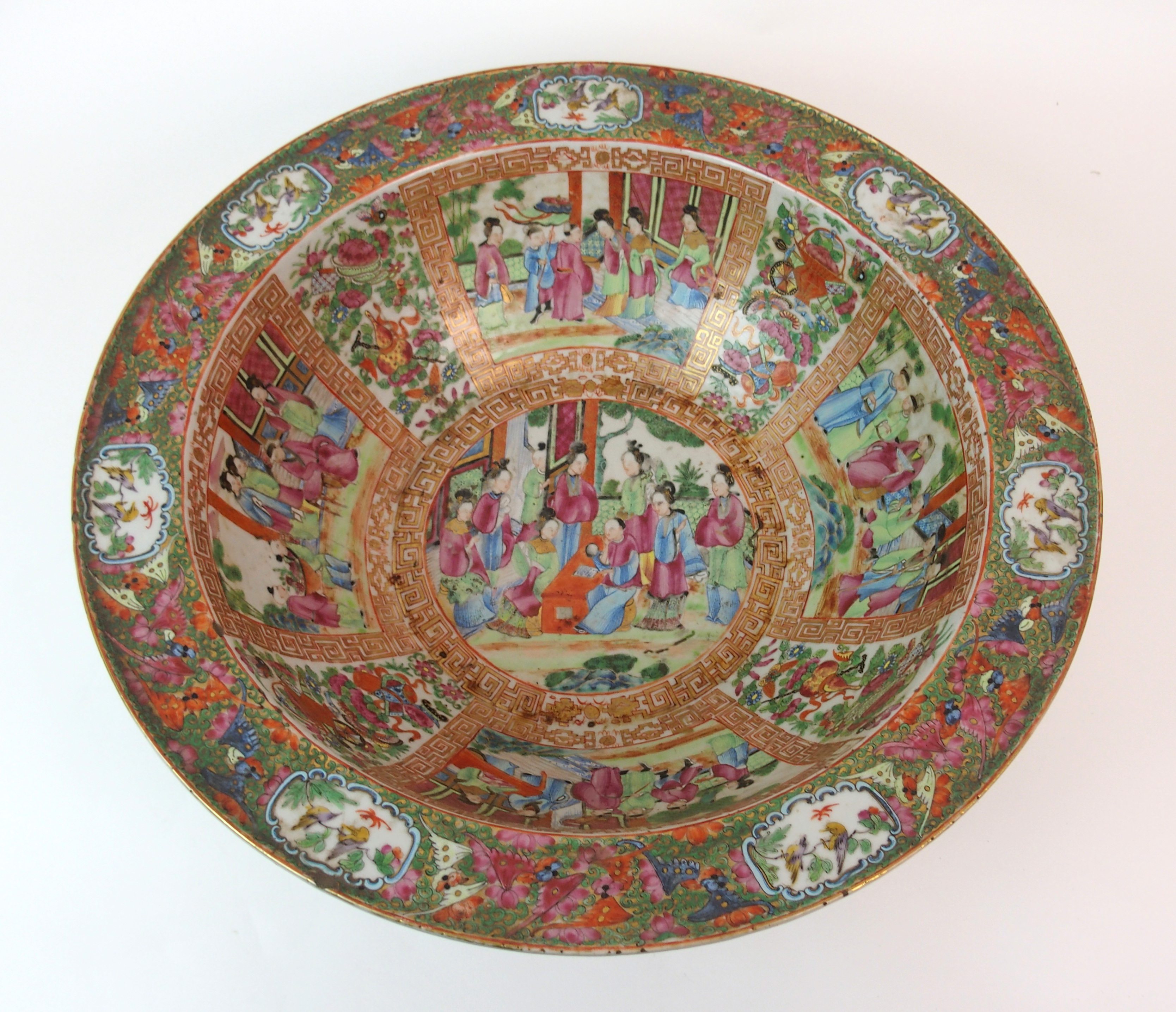 A Cantonese famille rose basin painted with panels of figures on balconies within gilt key pattern