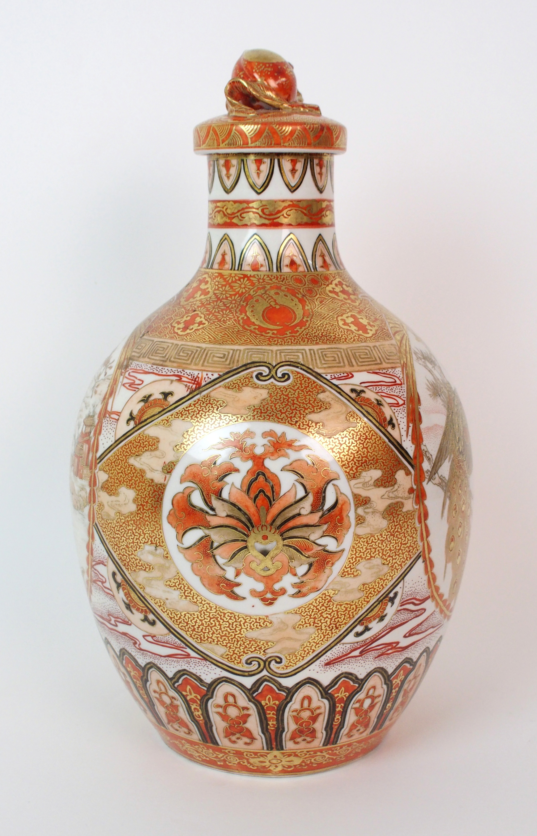 A Kutani bottle shaped vase and cover painted with medallions of figures, peacocks, pine within gilt - Image 2 of 10