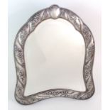 A Victorian silver mounted easel mirror maker's marks obscure, London 1887, of inverted shield shape