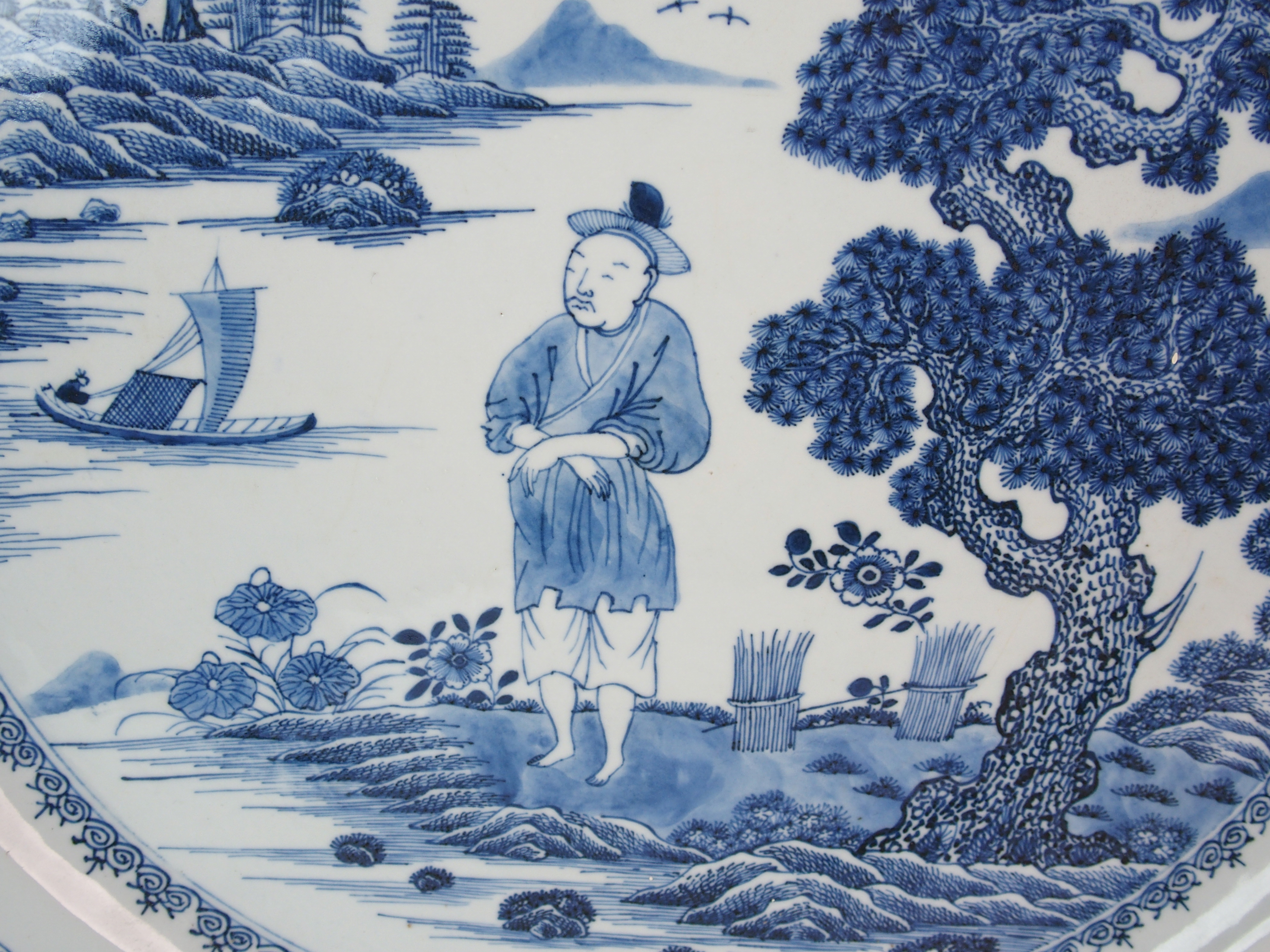 A Chinese blue and white charger painted with a man standing on an island beneath a pine tree - Image 2 of 10