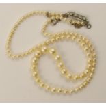 *WITHDRAWN* A string of vintage pearls with a platinum and diamond clasp pearls are tapered from