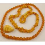 A collection of amber coloured jewellery a yellow amber chip necklace approx weight 33.7gms, a