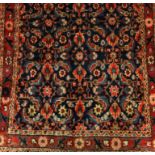 A Mahal runner on a red and blue ground, 4.15 x 1.00m