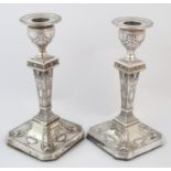 A matched pair of silver candlesticks by Fenton, Russell & Co. Limited, Sheffield 1905 and 1909.