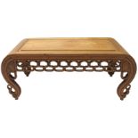 A Chinese hardwood low rectangular table with pierced interlaced frieze on scroll shaped legs, 100cm