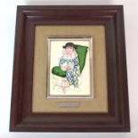 A framed enamelled plaque, after Pablo Picasso depicting a child harlequin, 16.5cm high x 11.5cm