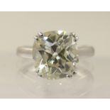 A 5ct cushion cut diamond ring simply split four claw set in 18ct white gold the substantial diamond