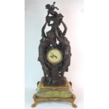 A French patinated spelter, gilt bronze and onyx figural clock depicting two classically draped