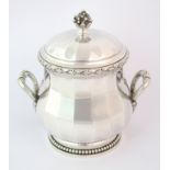 A French sterling silver sucrier stamped Puiforcat on the base.  The faceted bulbous circular body