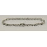 An 18ct white gold diamond line bracelet set with approximately 7.1cts of brilliant cut diamonds